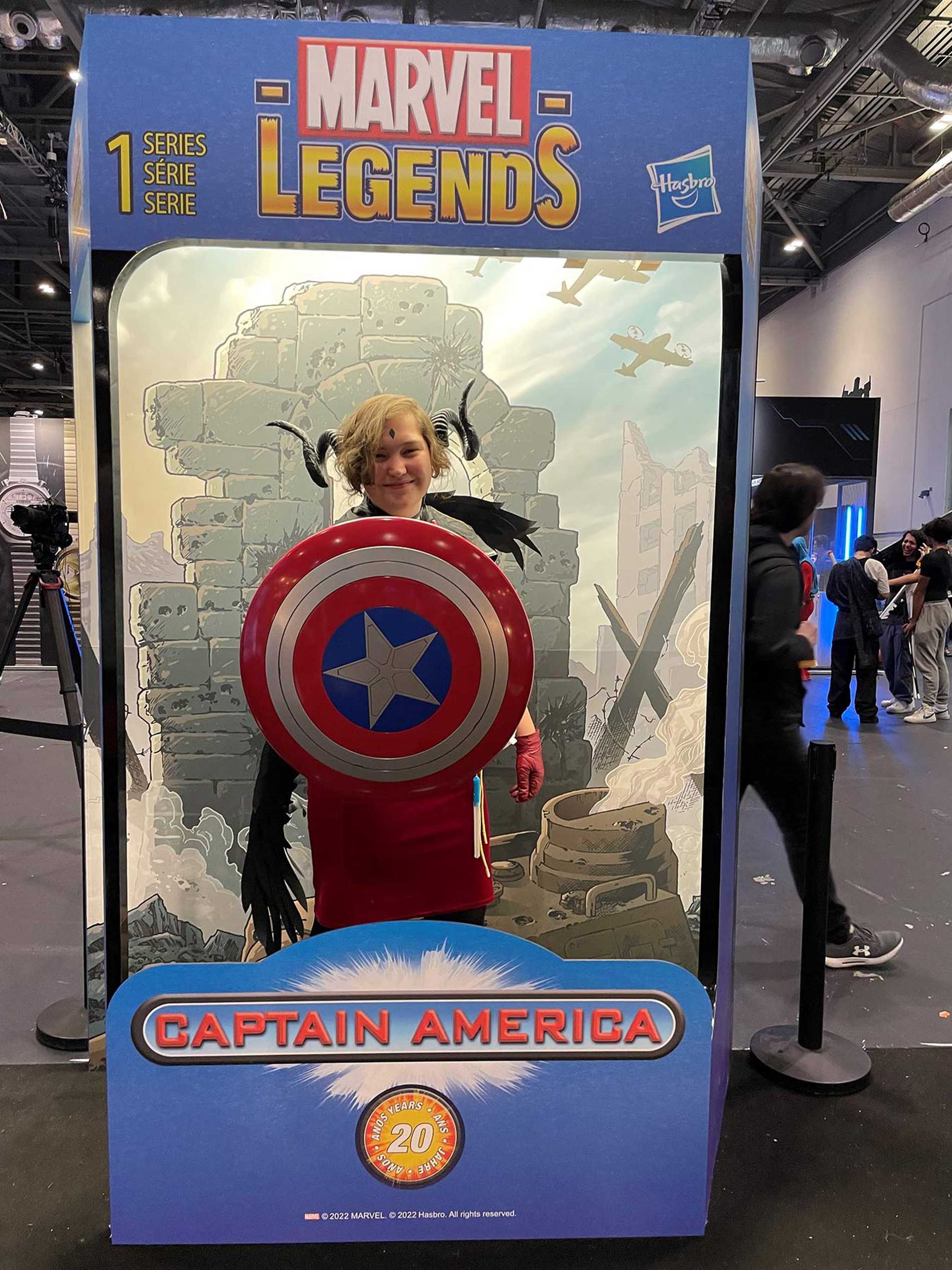 Elsie having her photo taken in a Captain America photo booth at London Comic Con