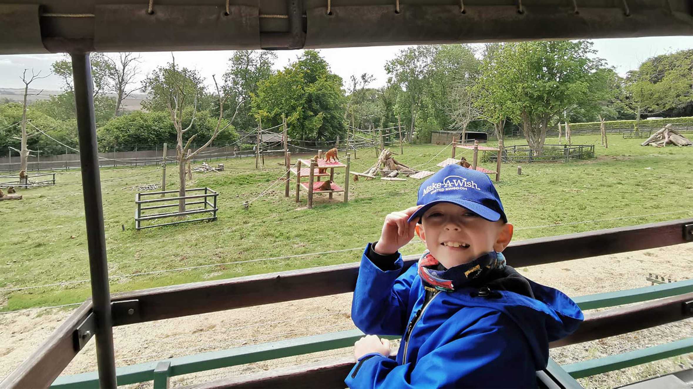 Caden passing the monkey enclosure during his safari.