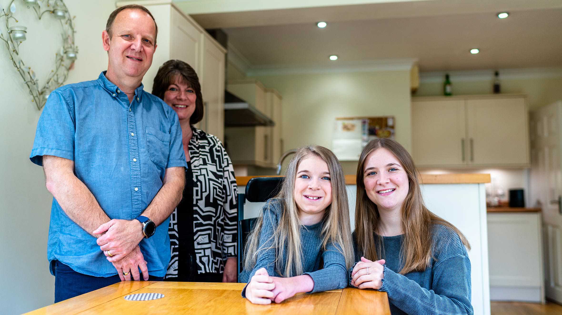Sophie with her mum, dad and sister.