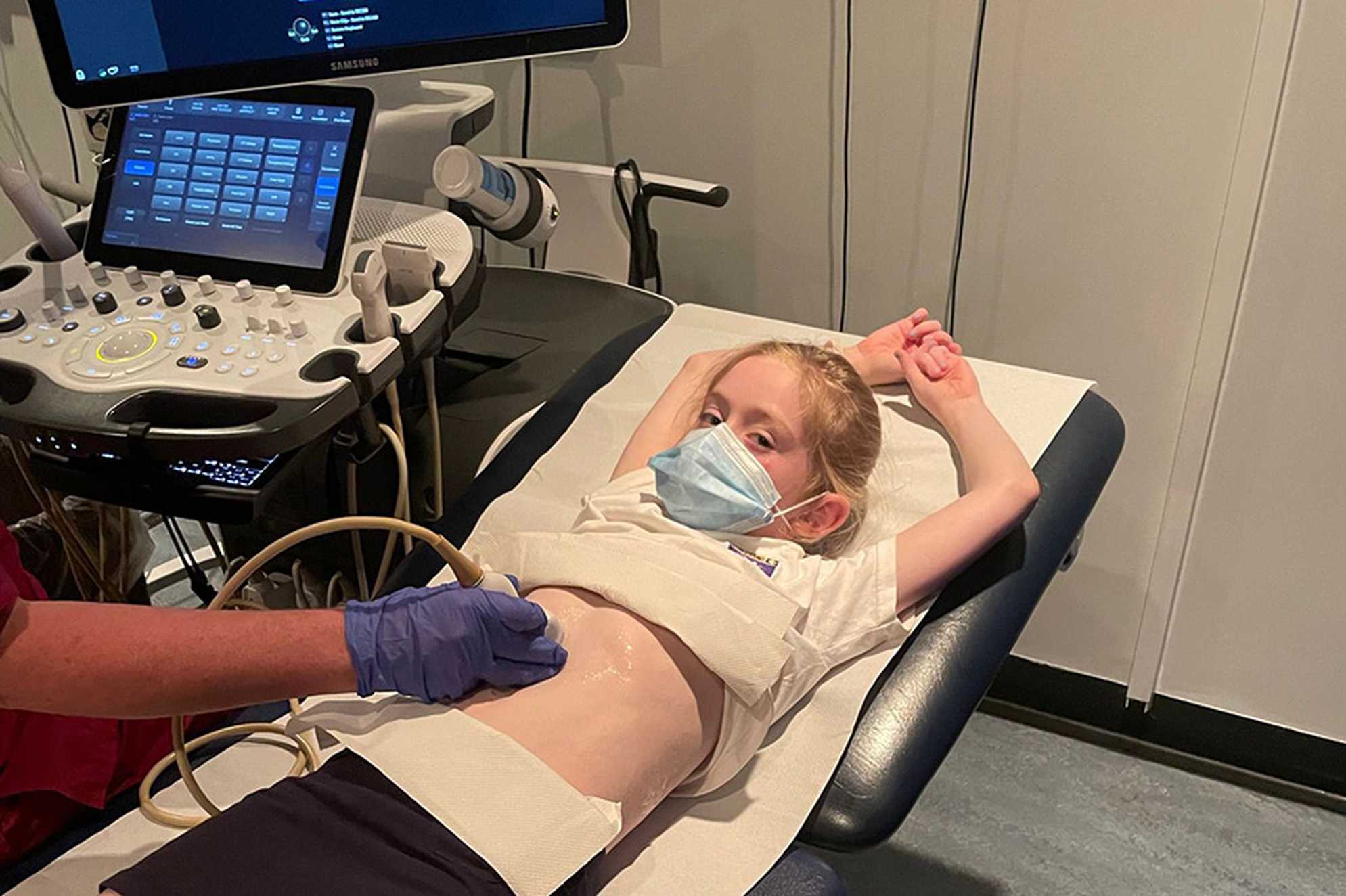 A treatment photo of Kate receiving an ultrasound